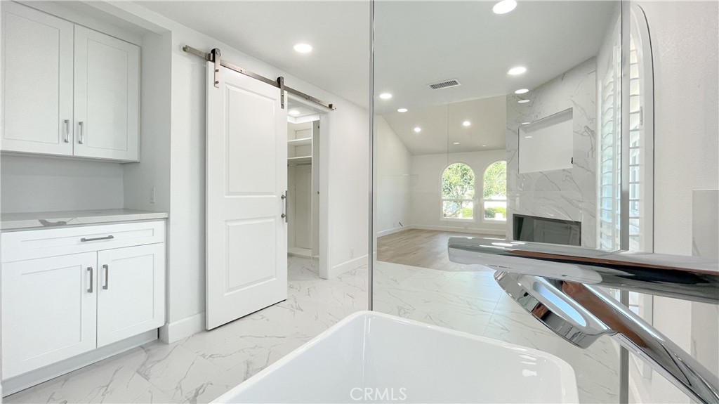 45 Westport Irvine, CA 92620 - Photo 39 of 45 a bathroom with a tub a sink and a shower