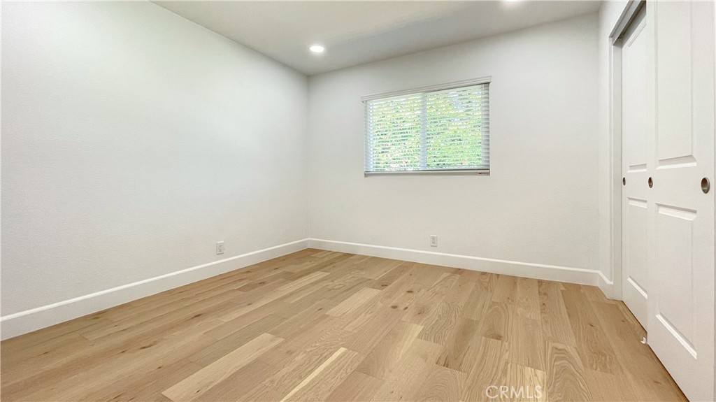45 Westport Irvine, CA 92620 - Photo 41 of 45 an empty room with wooden floor and windows