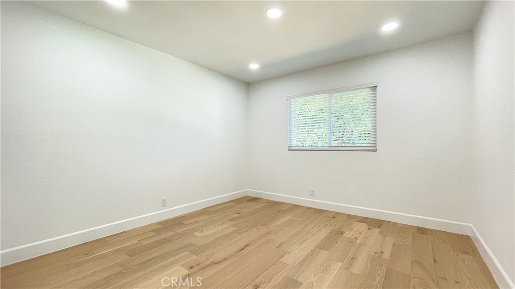 45 Westport Irvine, CA 92620 - Photo 43 of 45 an empty room with wooden floor and windows