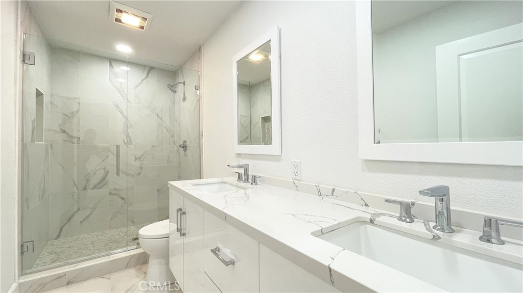 45 Westport Irvine, CA 92620 - Photo 44 of 45 a bathroom with a sink toilet and shower