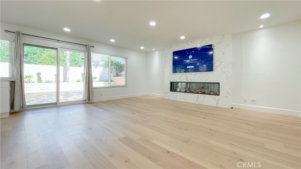 45 Westport Irvine, CA 92620 - Photo 6 of 45 a view of an empty room with a window and wooden floor