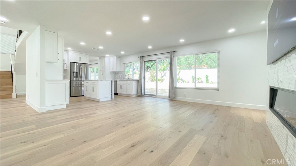 45 Westport Irvine, CA 92620 - Photo 7 of 45 a view of an empty room with a window and wooden floor