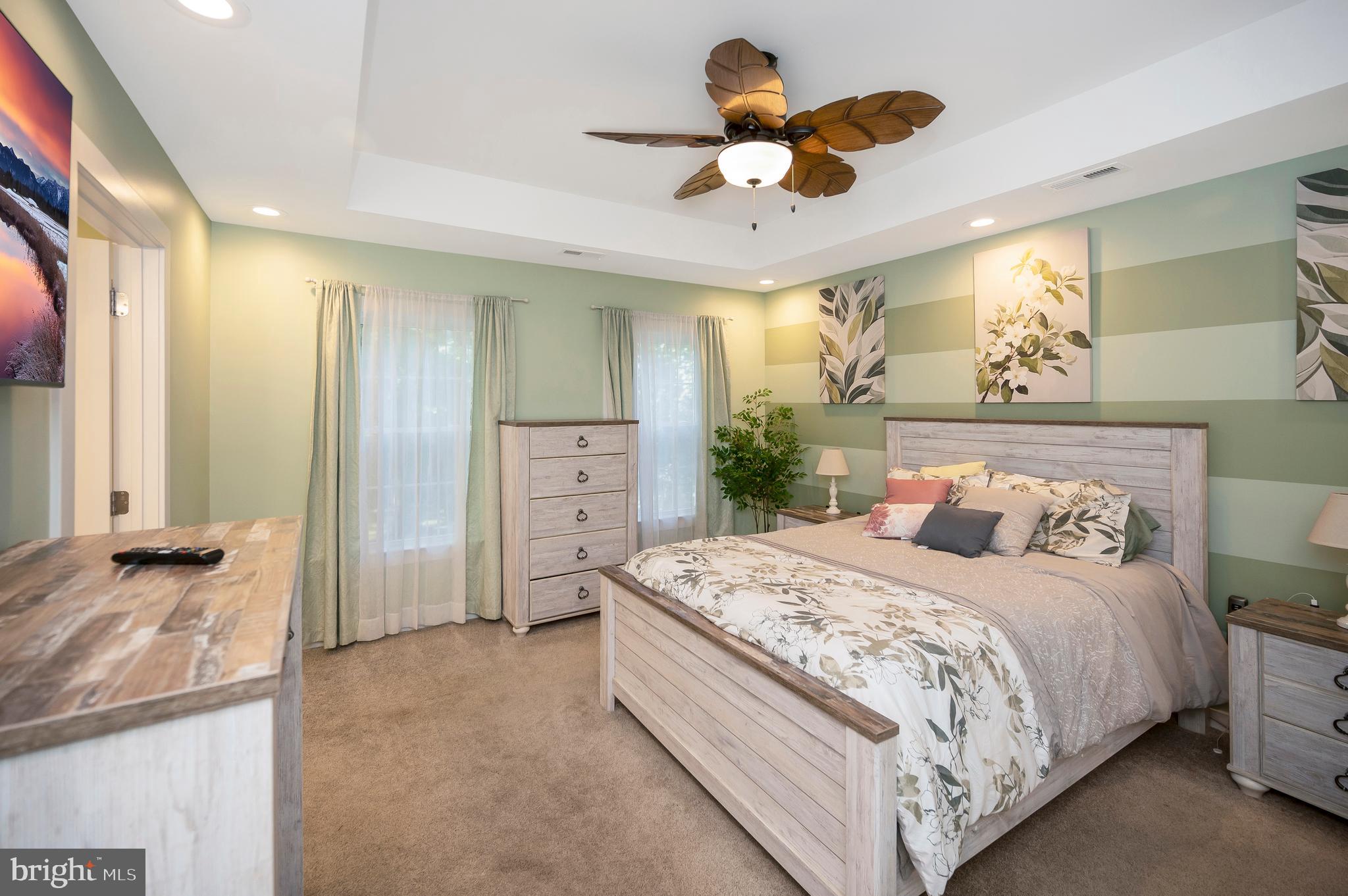 112 Butler Circle Locust Grove, VA 22508 - Photo 21 of 57 a bedroom with a bed and a chandelier