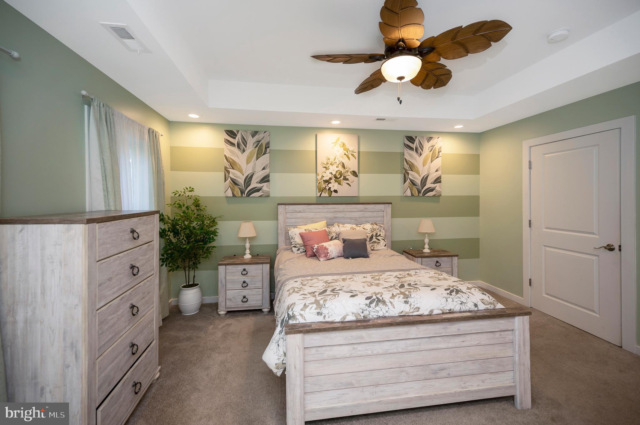 112 Butler Circle Locust Grove, VA 22508 - Photo 22 of 57 a bedroom with a bed and a chandelier