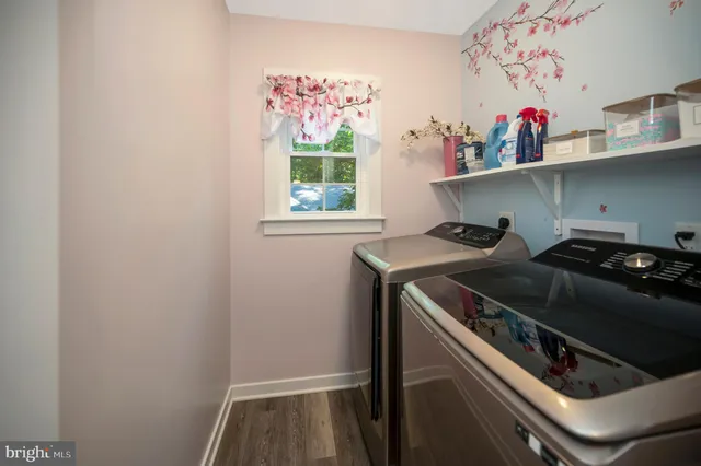 a view of a livingroom with a ceiling fan and window