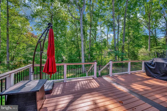 a view of a wooden fence with a yard