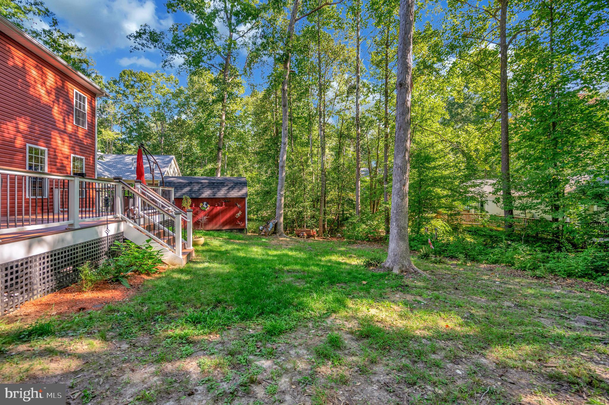 112 Butler Circle Locust Grove, VA 22508 - Photo 38 of 57 a backyard of a house with lots of green space and fountain