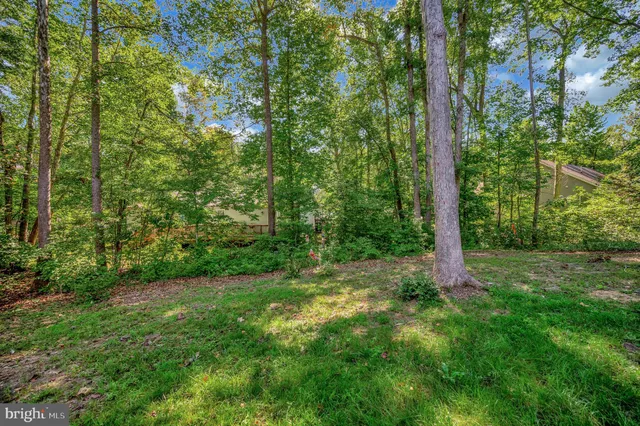a view of a dining area with furniture and wooden floor