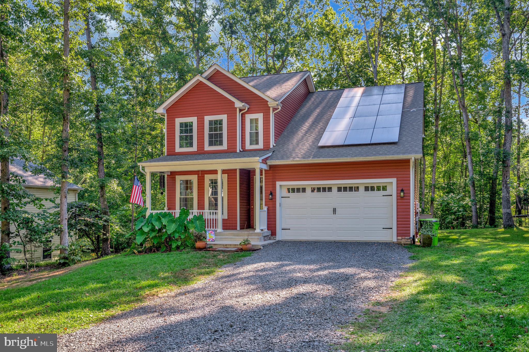 112 Butler Circle Locust Grove, VA 22508 - Photo 54 of 57 a front view of a house with a garden and yard
