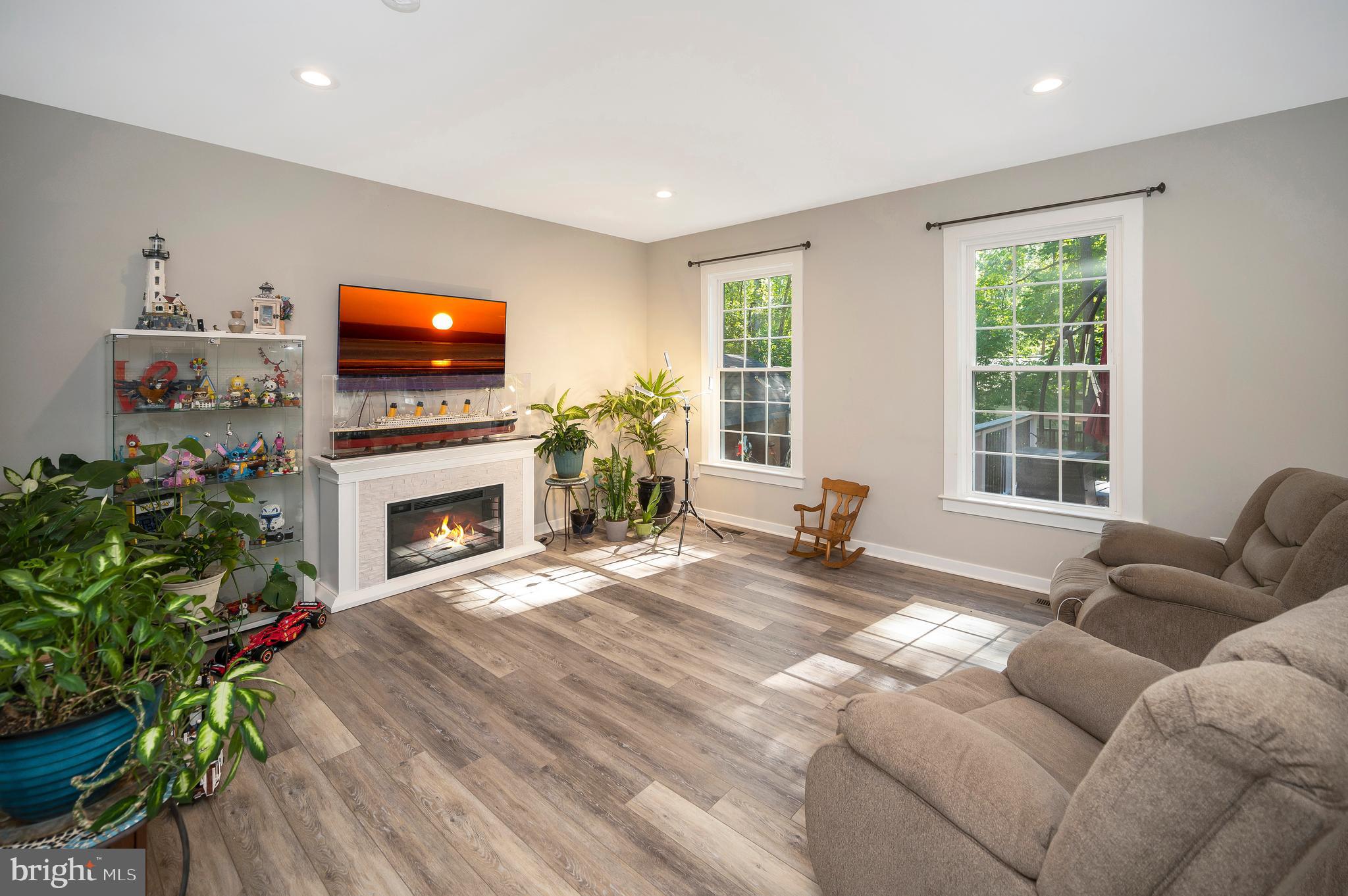 112 Butler Circle Locust Grove, VA 22508 - Photo 8 of 57 a living room with furniture a flat screen tv and a fireplace