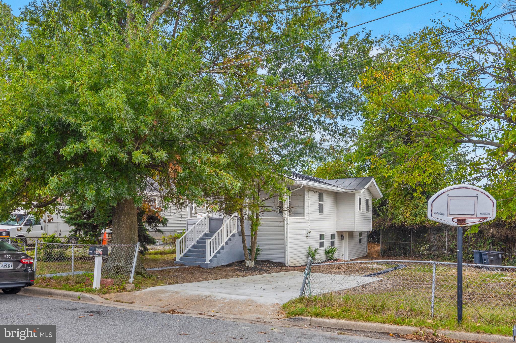1528 Hunt Avenue Landover, MD 20785 - Photo 1 of 27 a front view of a house with garden