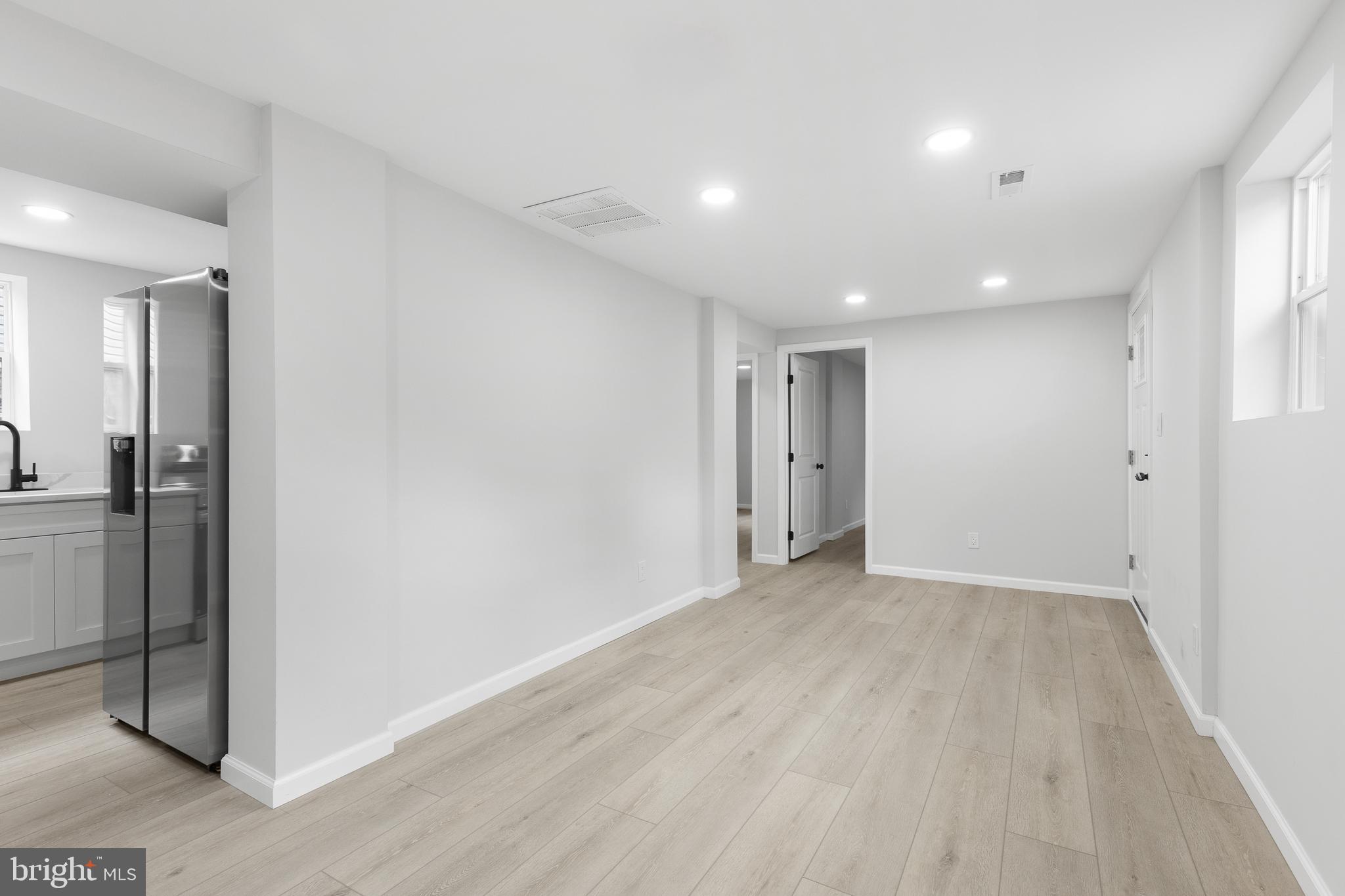 1528 Hunt Avenue Landover, MD 20785 - Photo 17 of 27 wooden floor in an empty room with a window