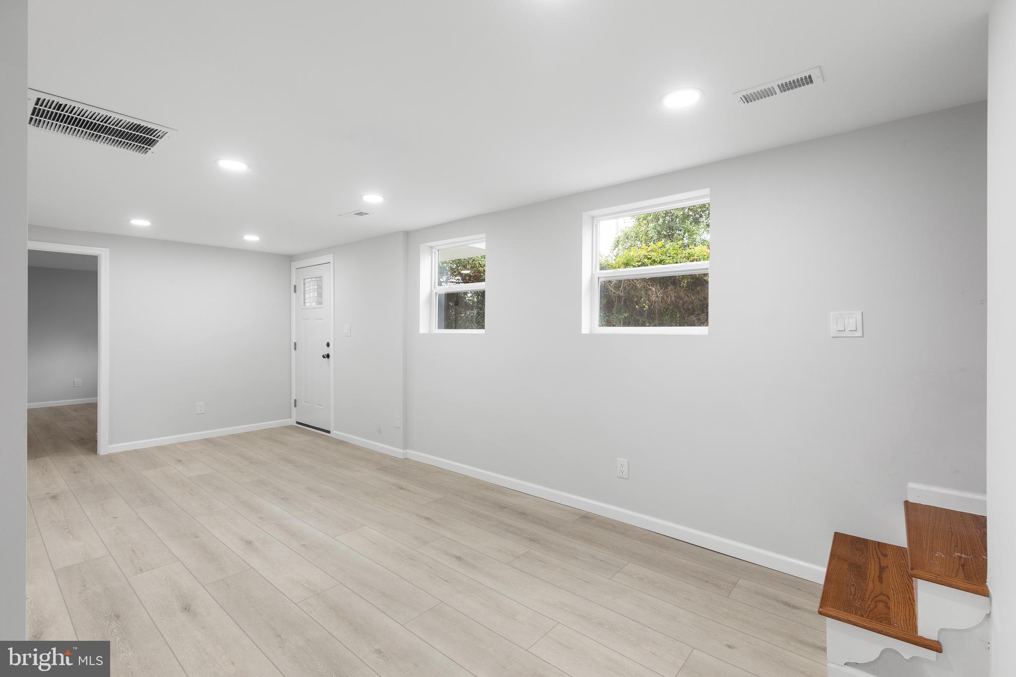1528 Hunt Avenue Landover, MD 20785 - Photo 18 of 27 an empty room with windows and closet