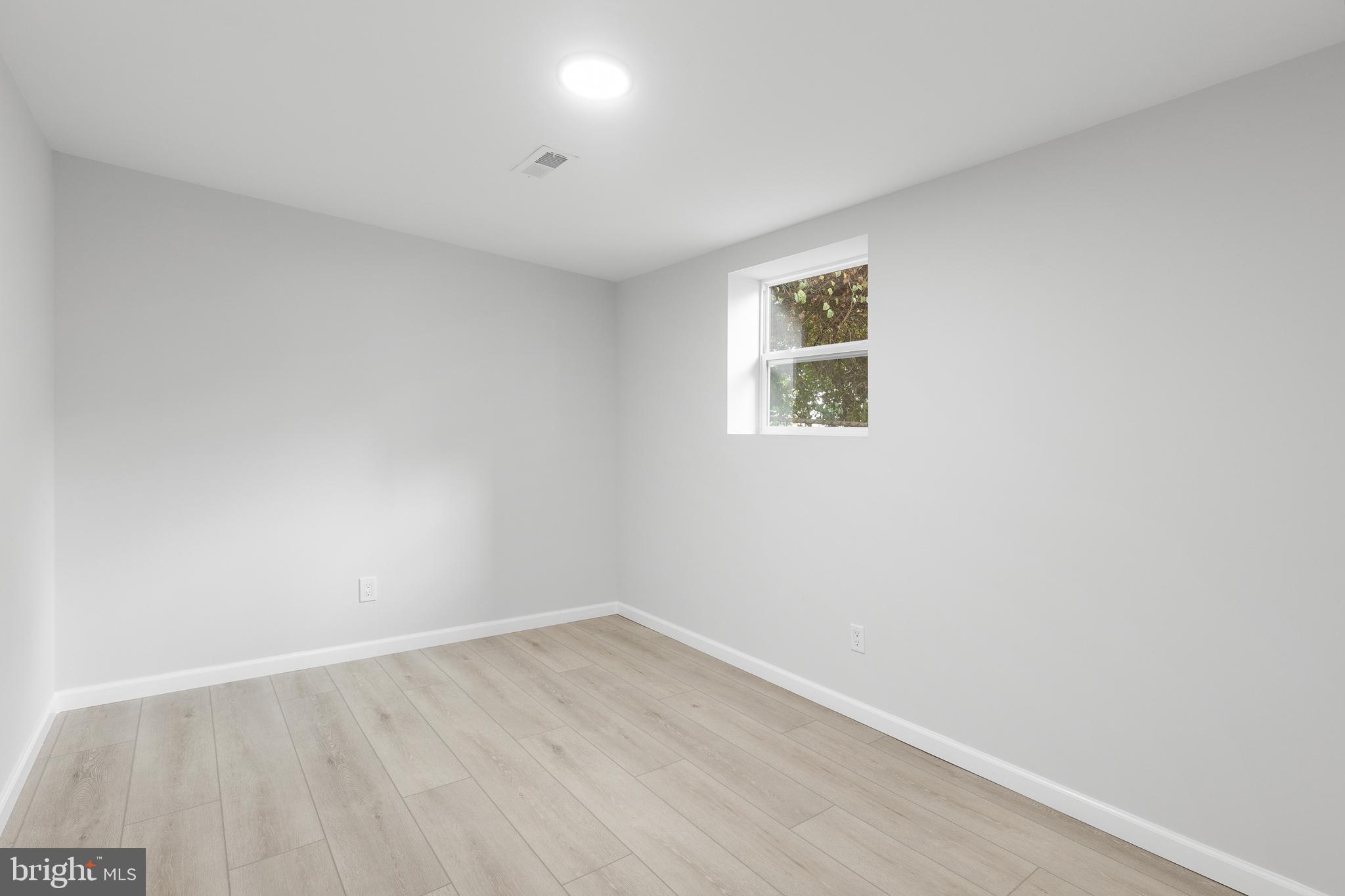1528 Hunt Avenue Landover, MD 20785 - Photo 23 of 27 an empty room with a window