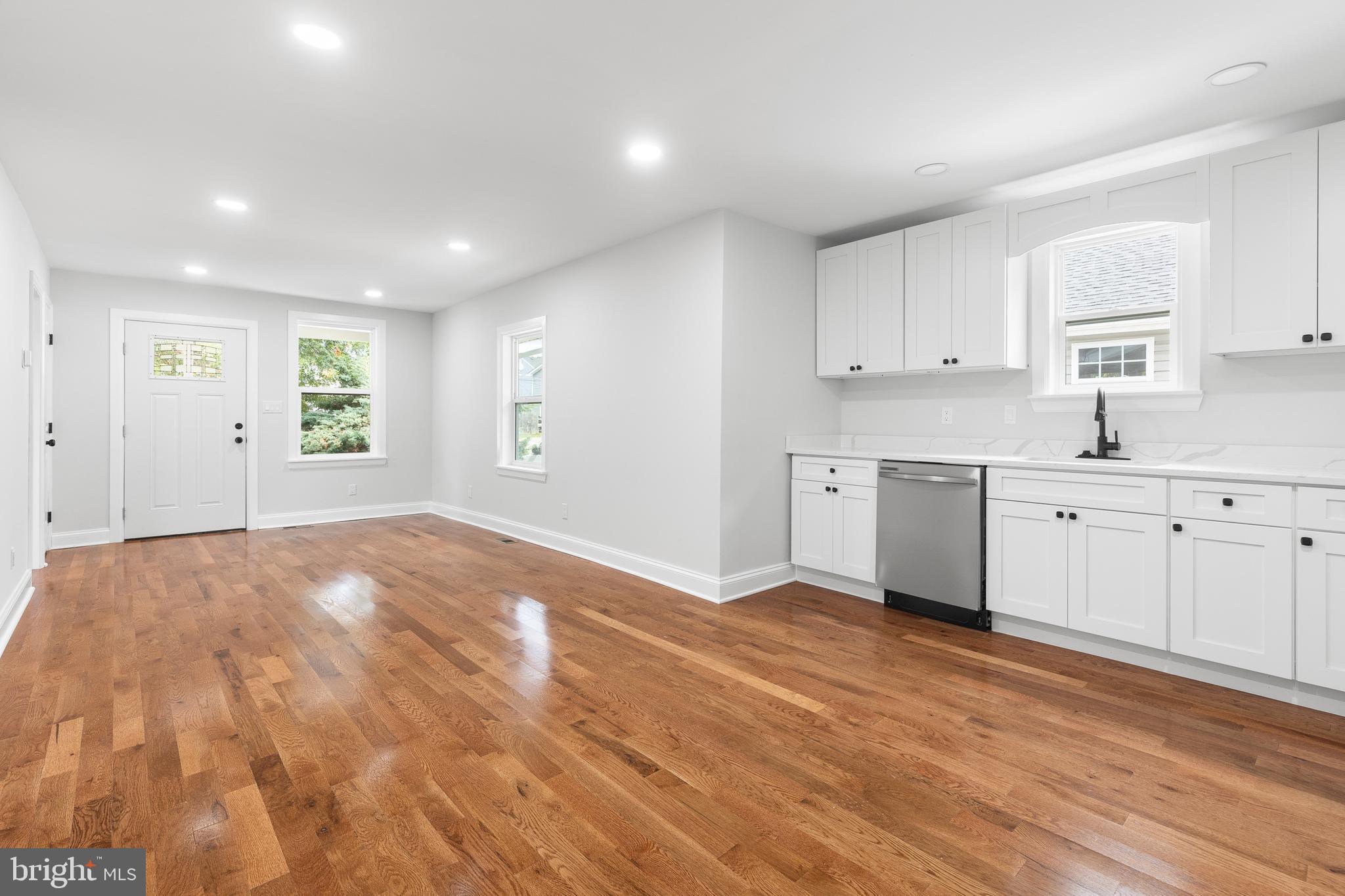 1528 Hunt Avenue Landover, MD 20785 - Photo 6 of 27 a view of a kitchen with a sink dishwasher white cabinets and a refrigerator