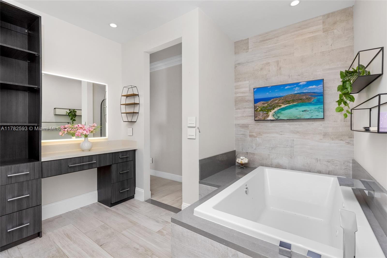 10972 Pine Lodge Trail Davie, FL 33328 - Photo 12 of 21 a bathroom with a tub sink and mirror