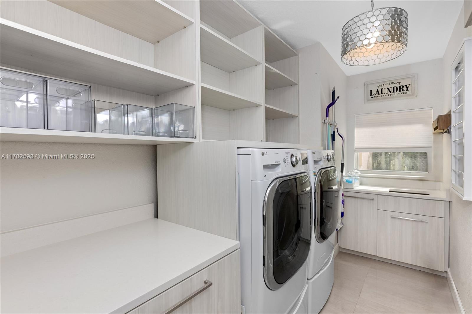 10972 Pine Lodge Trail Davie, FL 33328 - Photo 16 of 21 a utility room with dryer and washer