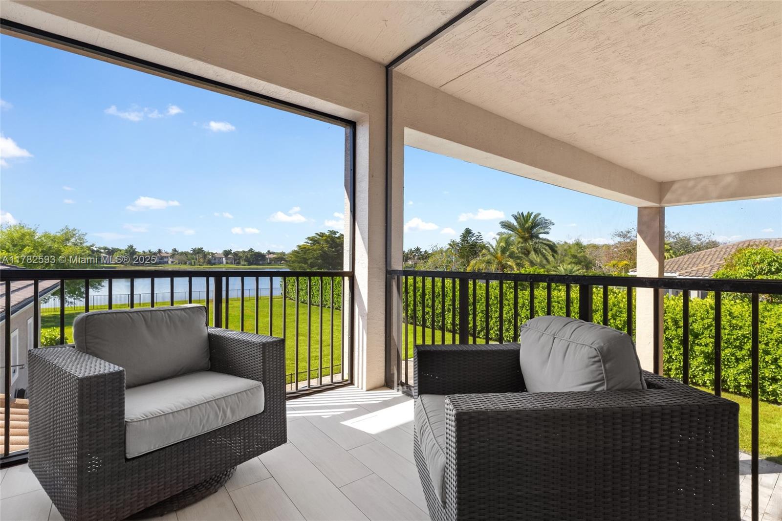 10972 Pine Lodge Trail Davie, FL 33328 - Photo 18 of 21 a balcony with furniture and a floor to ceiling window