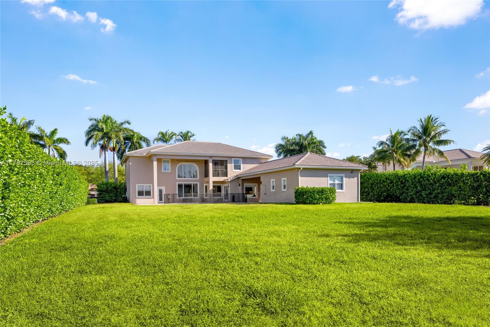10972 Pine Lodge Trail Davie, FL 33328 - Photo 20 of 21 a view of a house with a yard and potted plants