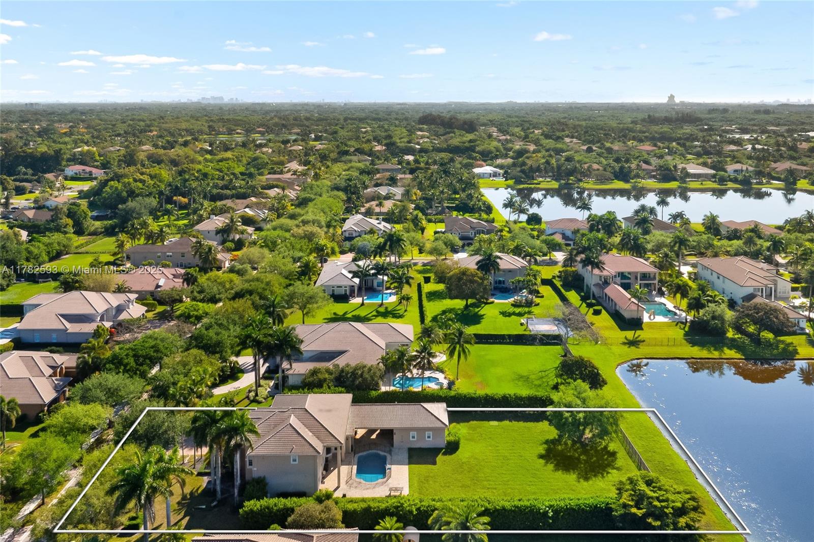 10972 Pine Lodge Trail Davie, FL 33328 - Photo 2 of 21 an aerial view of residential houses with outdoor space and trees