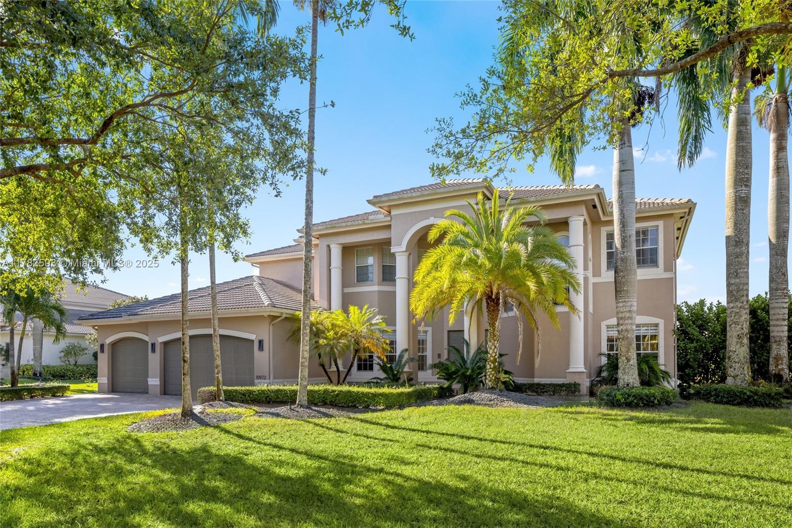10972 Pine Lodge Trail Davie, FL 33328 - Photo 3 of 21 a view of a building with a yard