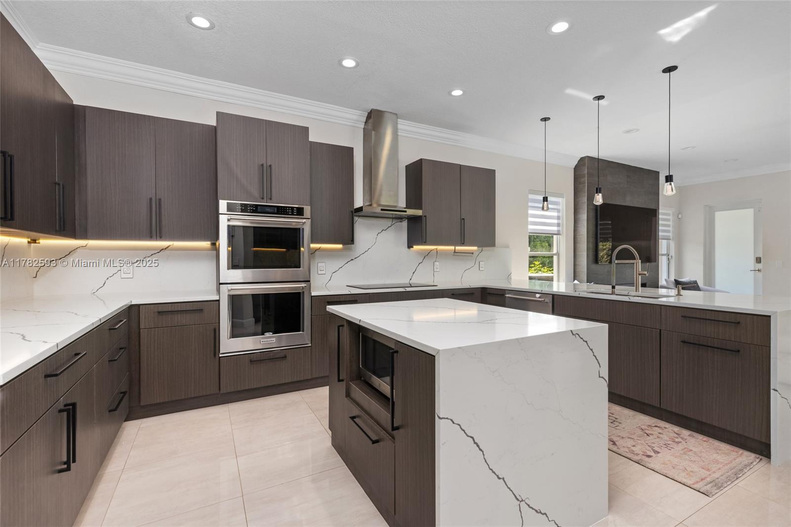 10972 Pine Lodge Trail Davie, FL 33328 - Photo 8 of 21 a kitchen with stainless steel appliances granite countertop a sink a stove a refrigerator and a oven