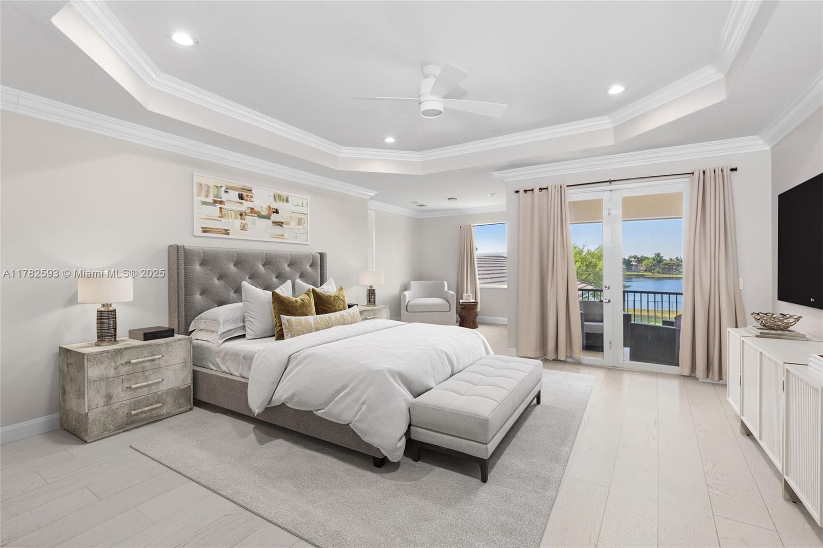 10972 Pine Lodge Trail Davie, FL 33328 - Photo 9 of 21 a bedroom with a bed a flat screen tv and a couch