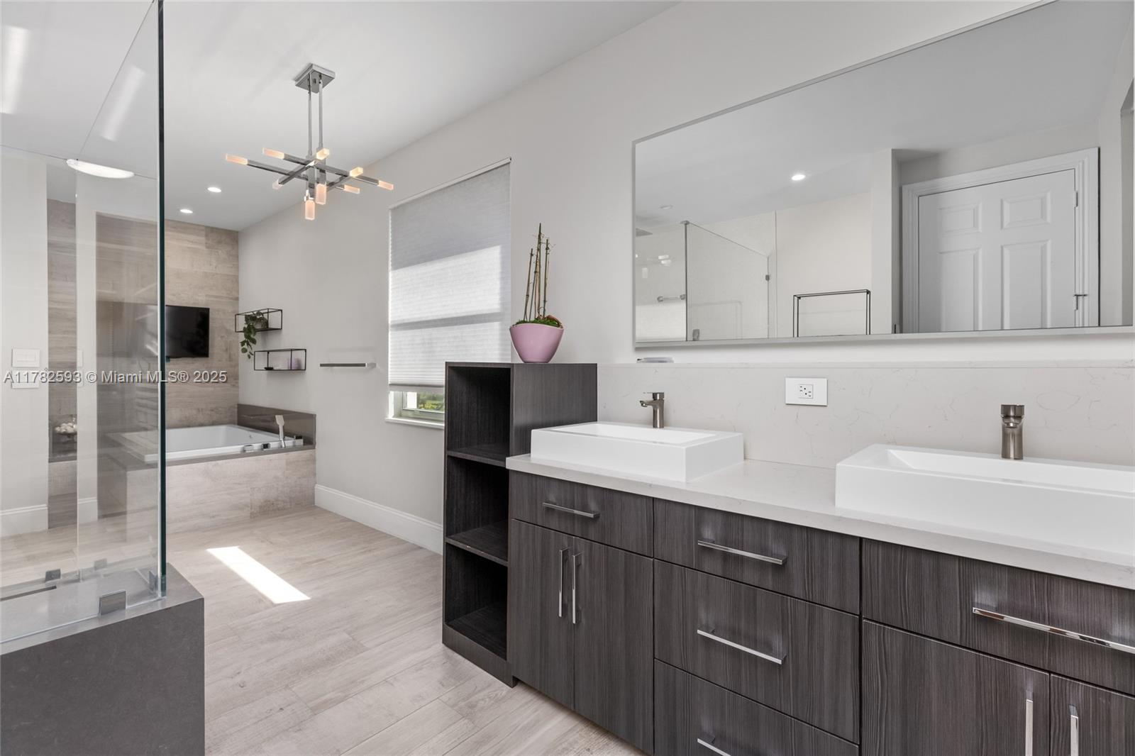 10972 Pine Lodge Trail Davie, FL 33328 - Photo 10 of 21 a kitchen with a sink chandelier and refrigerator
