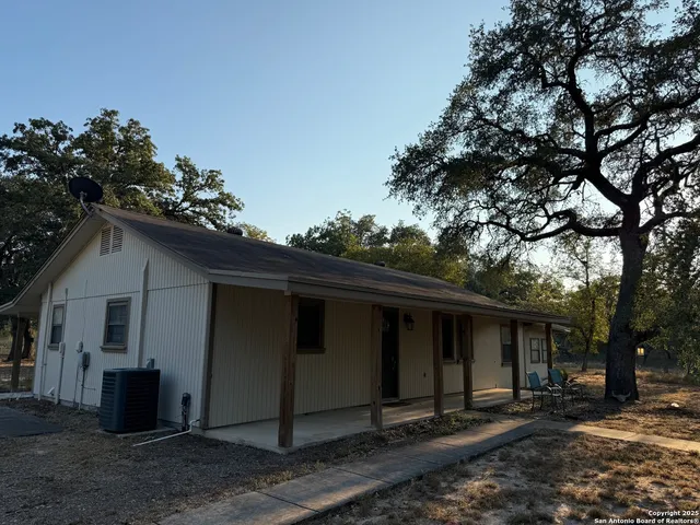 a house with a tree in the background