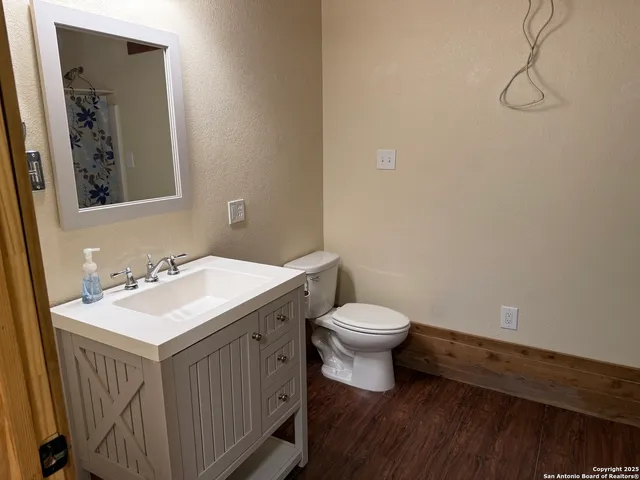 a view of empty room with stairs and a window