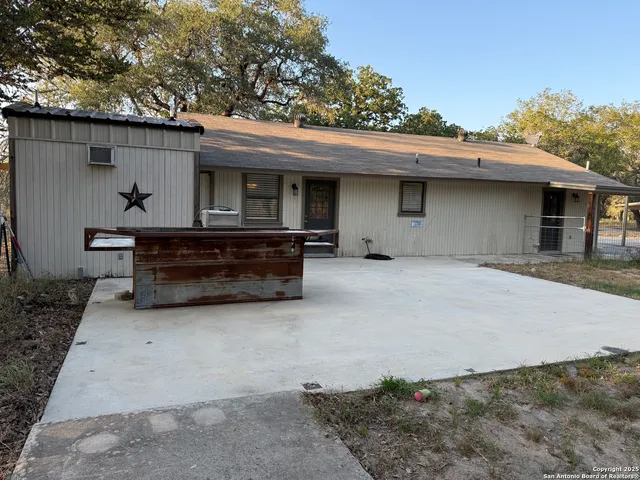 a view of a tree in front of a house