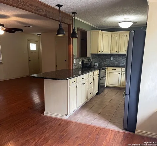 a bathroom with a sink vanity and a toilet
