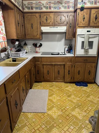 a kitchen with a sink and cabinets