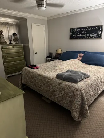 a bedroom with bed and window