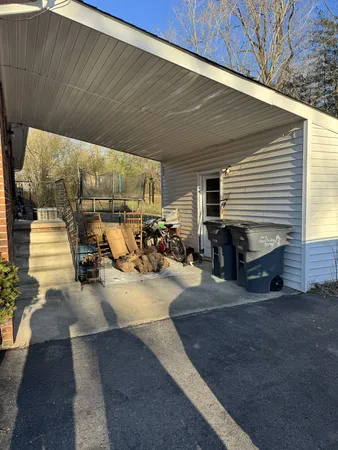 a view of a garage with parked cars