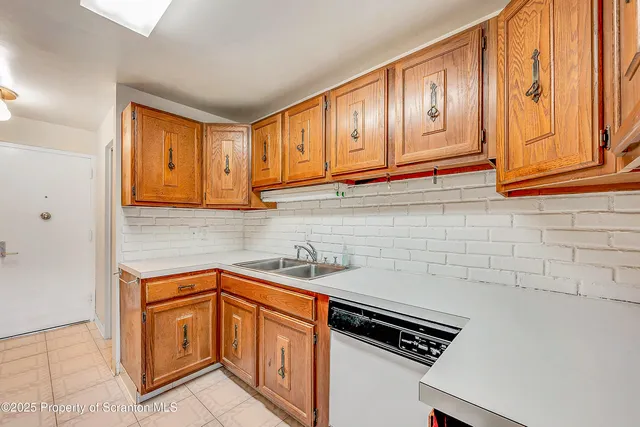 a kitchen that has a sink and a stove