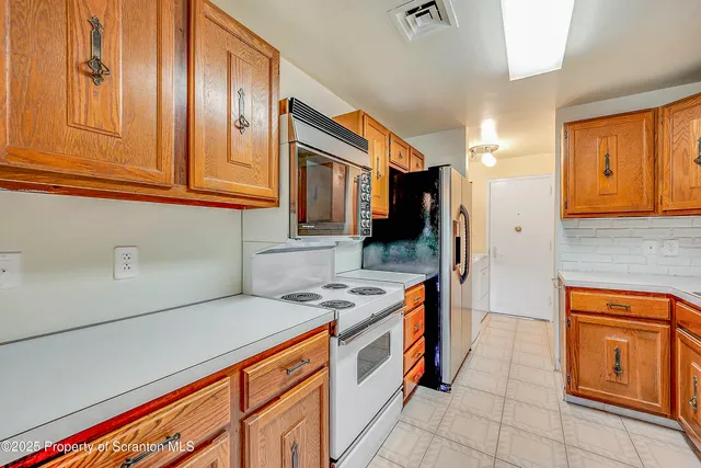 a kitchen that has a sink and a stove