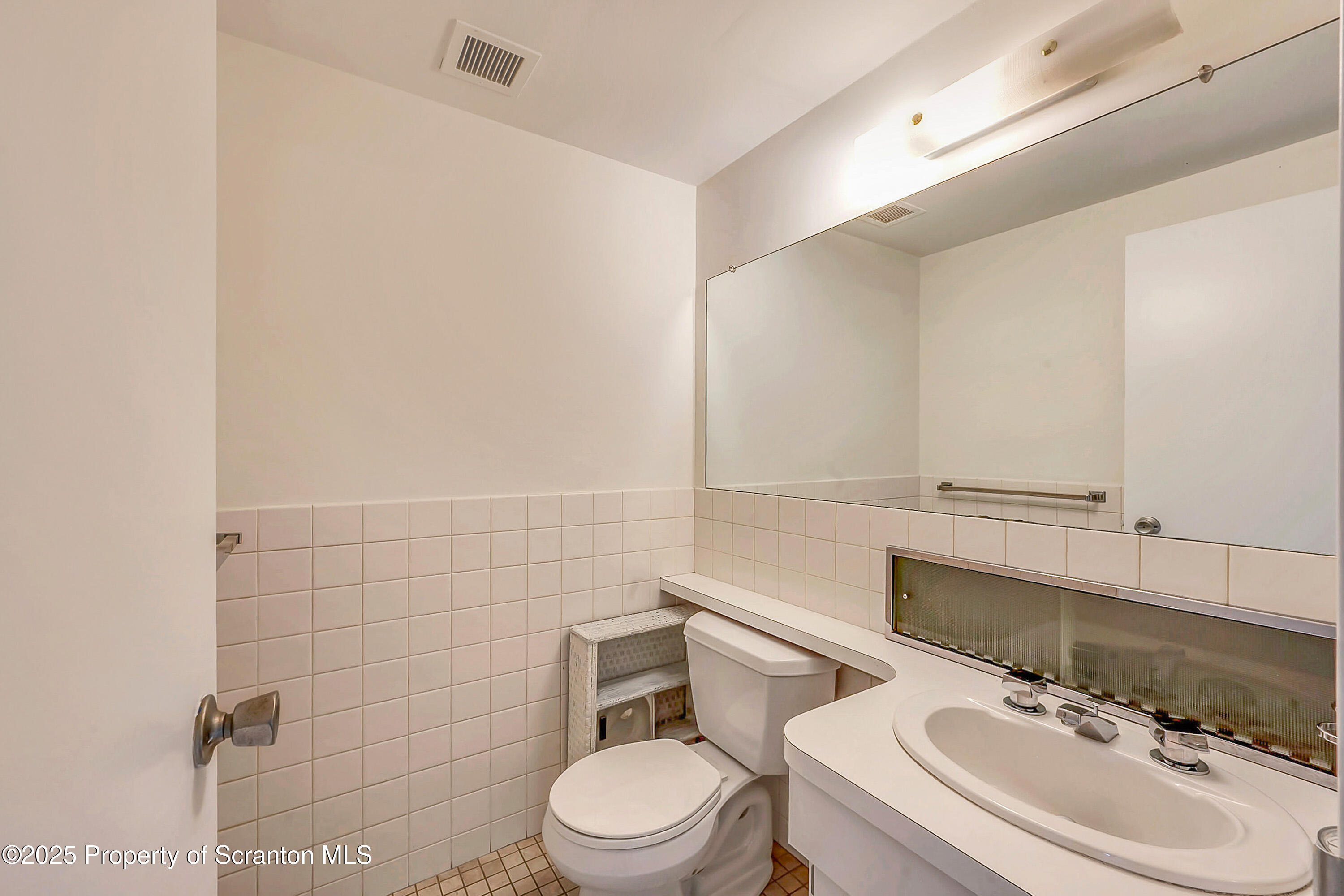 550 Clay Avenue, Unit 3B Scranton, PA 18510 - Photo 17 of 17 a bathroom with a sink mirror and toilet