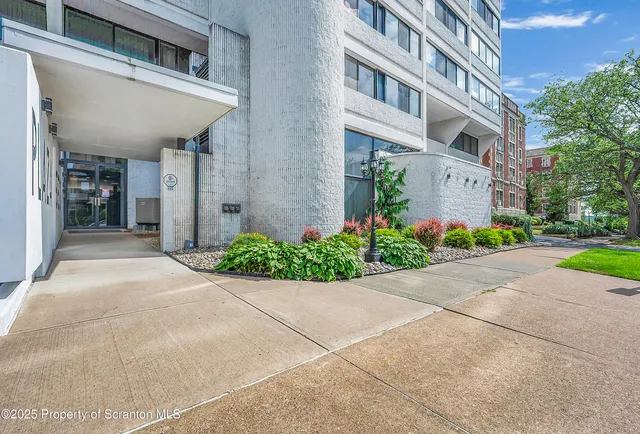 a view of a building with a yard