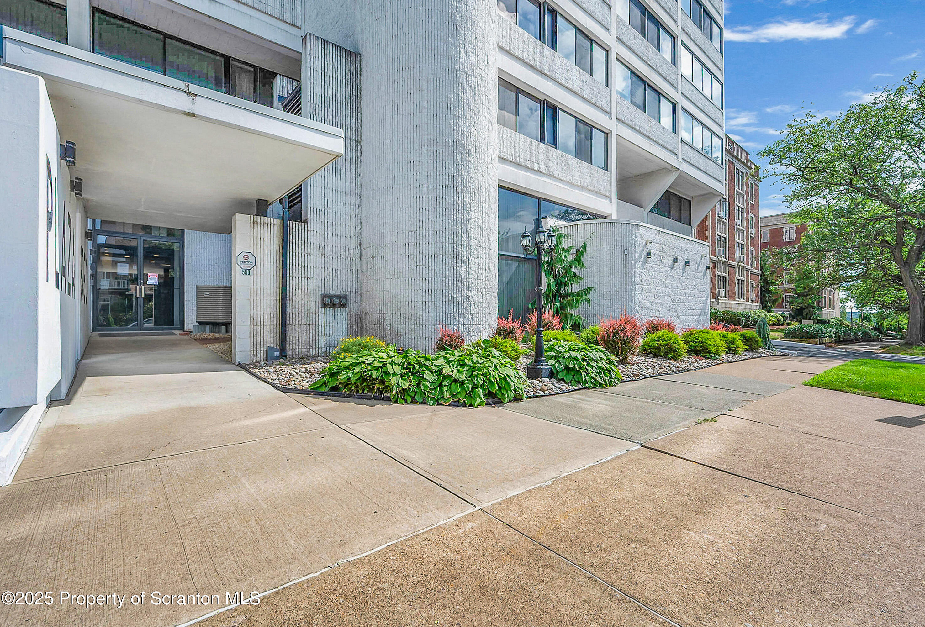 550 Clay Avenue, Unit 3B Scranton, PA 18510 - Photo 2 of 17 a view of a building with a yard