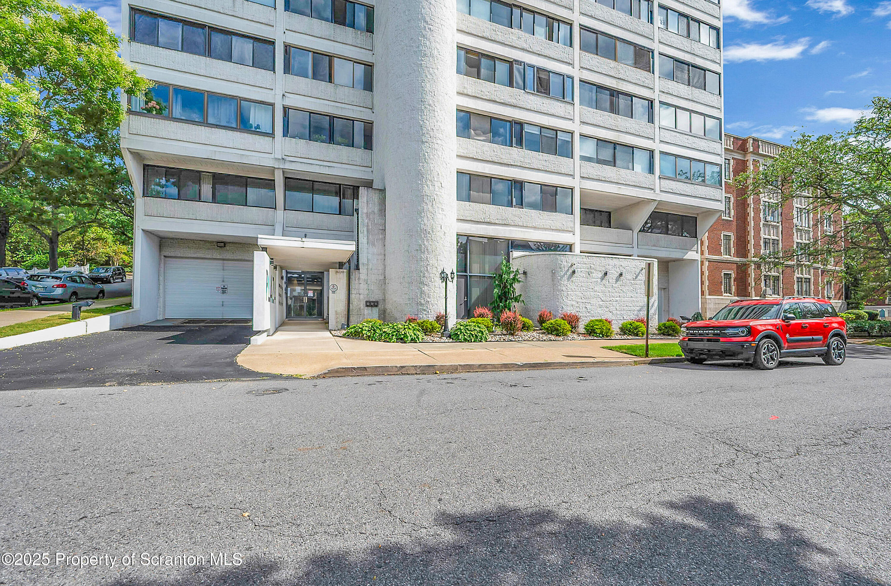 550 Clay Avenue, Unit 3B Scranton, PA 18510 - Photo 3 of 17 a view of building with cars parked across