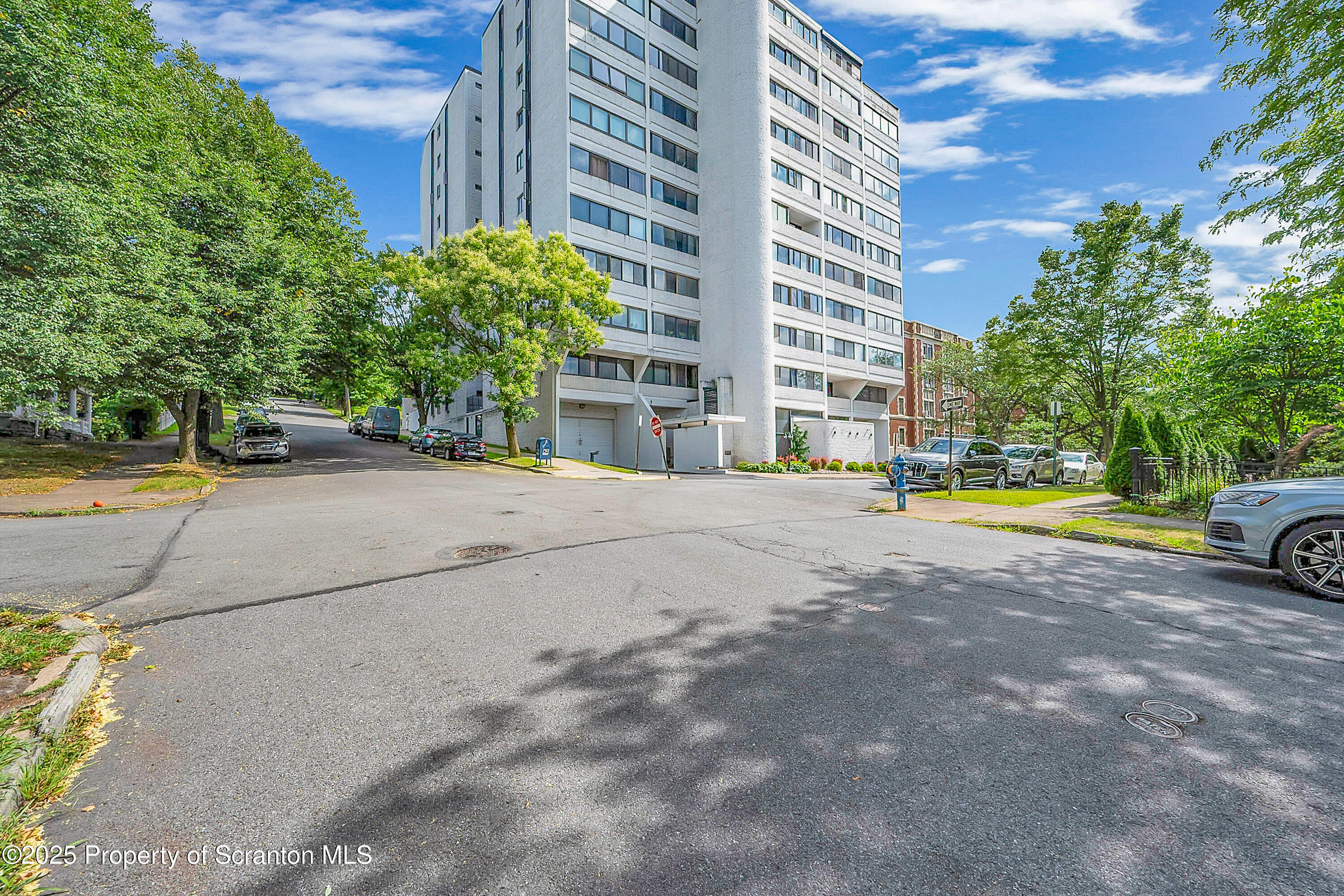 550 Clay Avenue, Unit 3B Scranton, PA 18510 - Photo 4 of 17 a view of building with cars parked in front of it