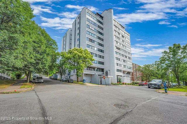 a city street lined with buildings and cars