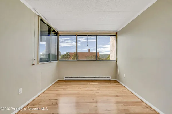 a view of an empty room with a window