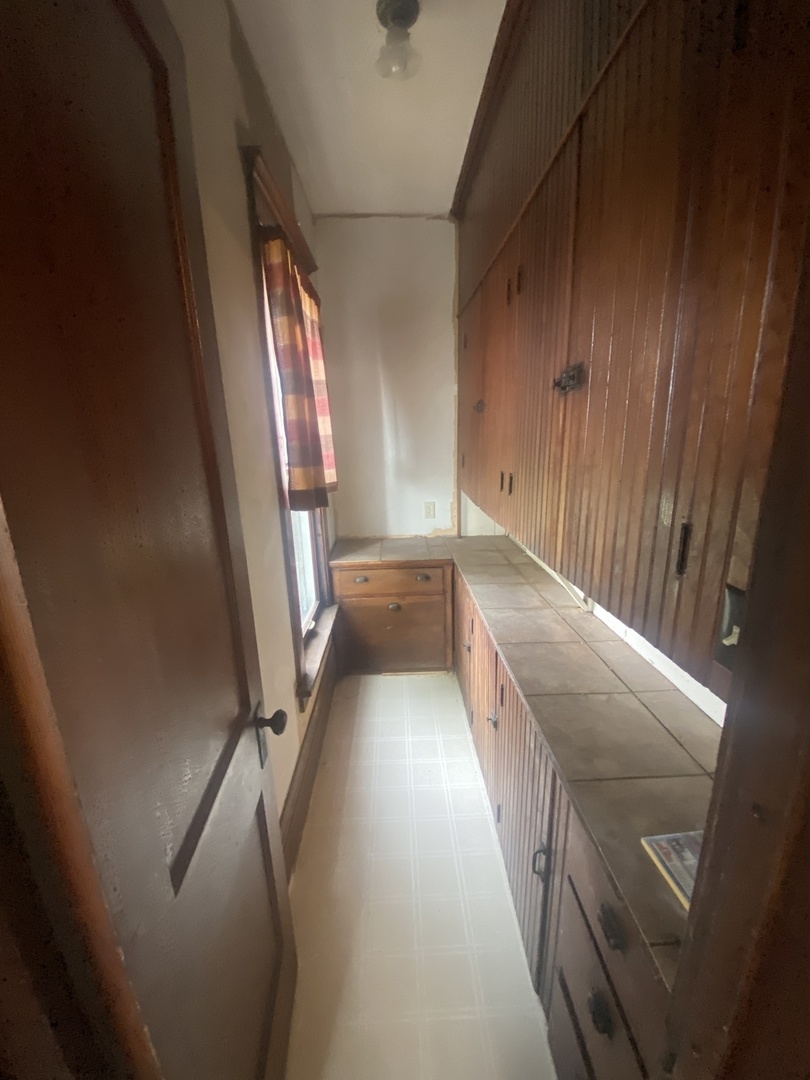 4684 Perry Road Malta, IL 60150 - Photo 15 of 36 a view of an empty room with wooden floor and a window