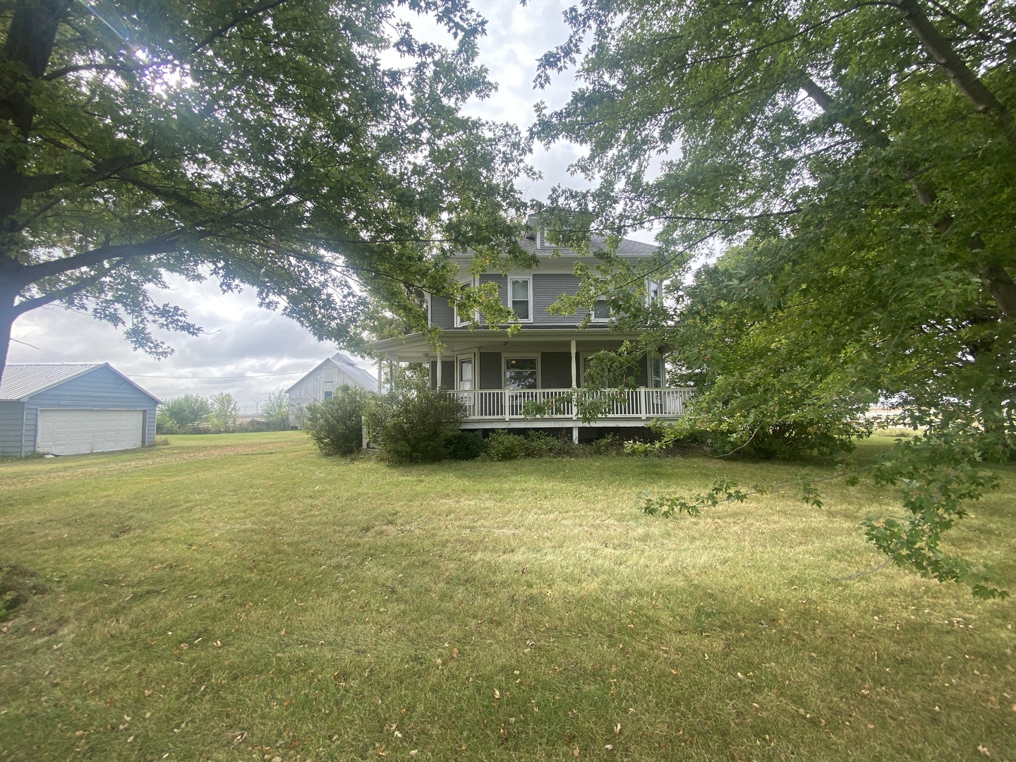 4684 Perry Road Malta, IL 60150 - Photo 3 of 36 a view of a house with a large tree