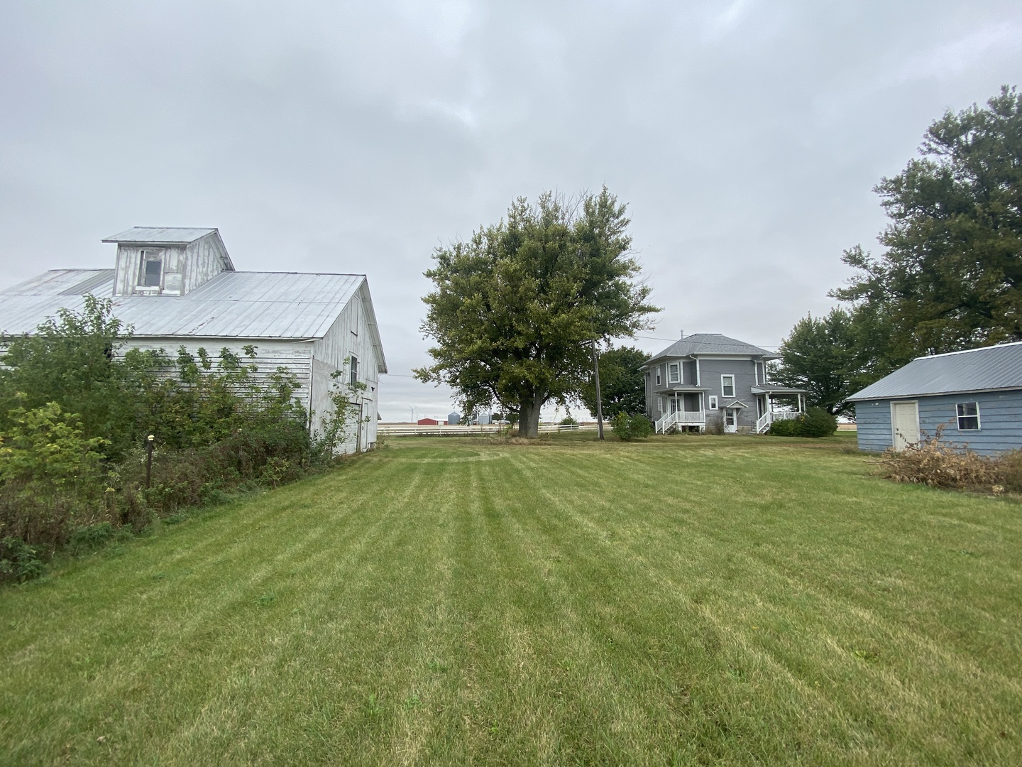4684 Perry Road Malta, IL 60150 - Photo 25 of 36 a front view of a house with a yard