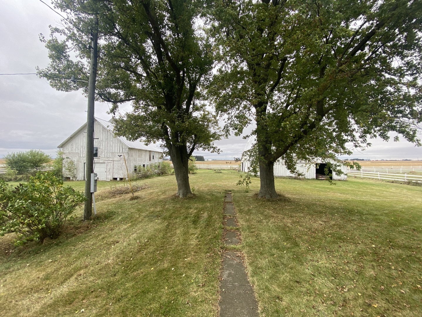 4684 Perry Road Malta, IL 60150 - Photo 31 of 36 a view of a house with a yard