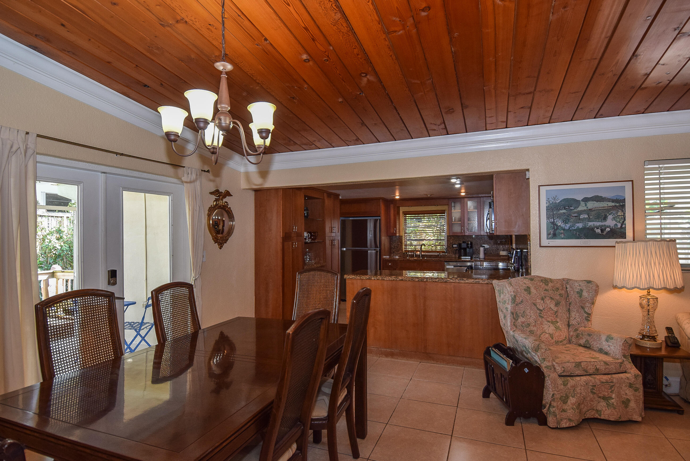 334 3rd Road Key Largo, FL 33037 - Photo 13 of 30 a living room with furniture a chandelier and a dining table