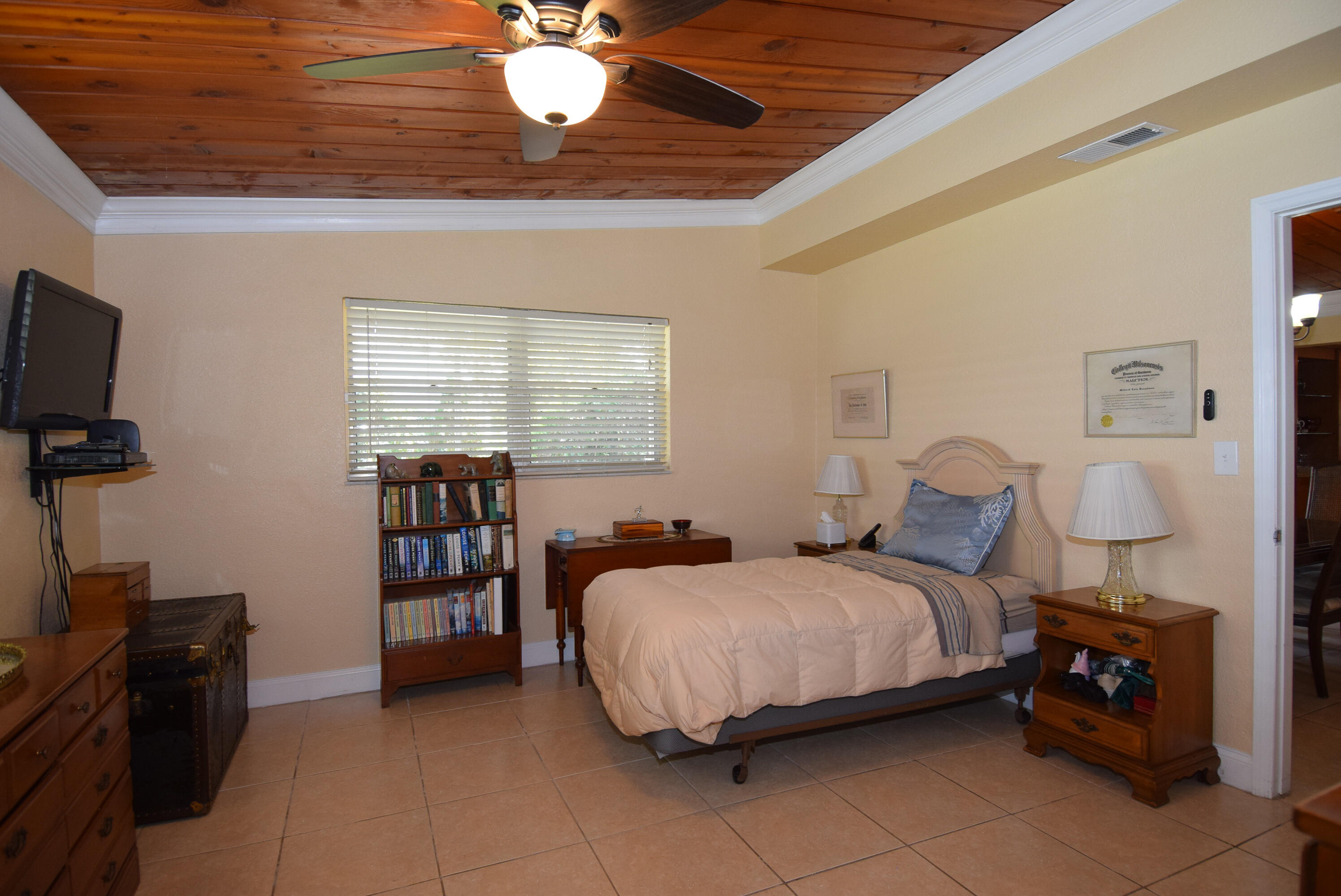 334 3rd Road Key Largo, FL 33037 - Photo 14 of 30 a bedroom with a bed and a flat screen tv